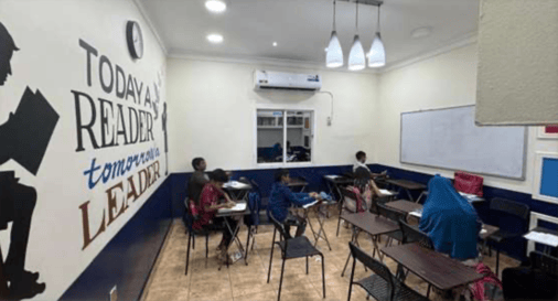 Teacher assisting student at Tuition Point